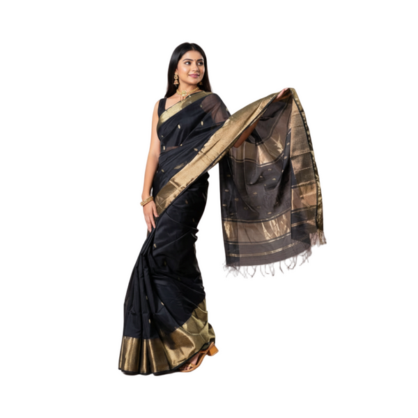 Black Maheshwari handloom silk by cotton saree with golden buti motifs and zari border, elegant traditional wedding and festive wear.