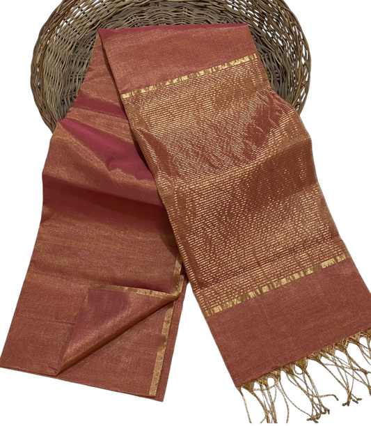 Brown and gold woven fabric with a basket in the background